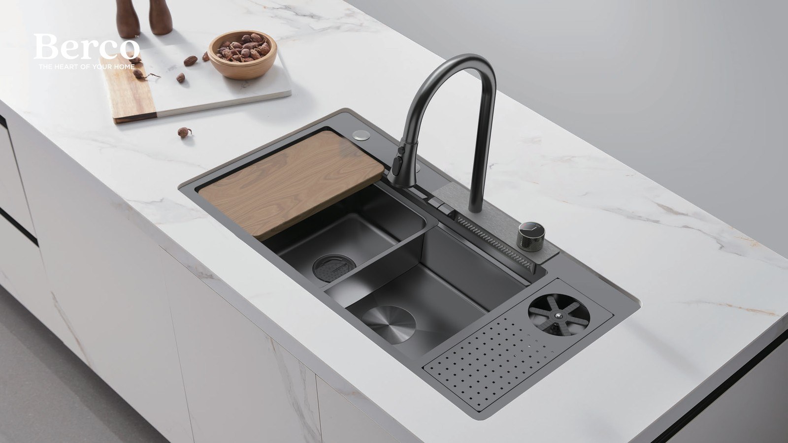 Multifunction workstation sink with a walnut board and colander set into a marble island. Berco design reference